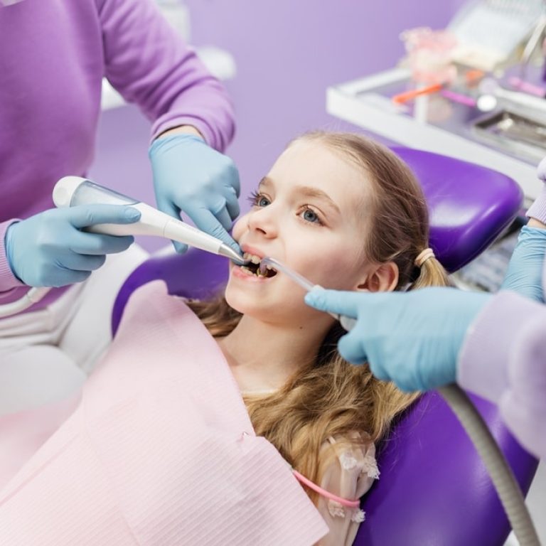 Spot,Illumination,Of,A,Tooth,With,Caries,Using,A,Lamp.