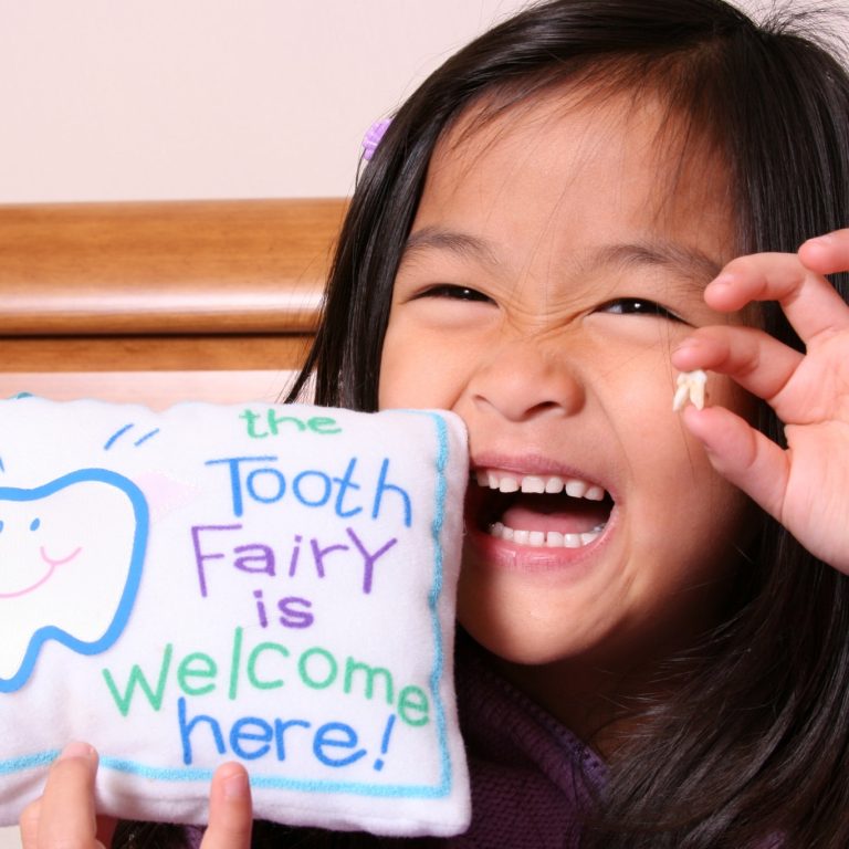 Cute little girl ready for the Tooth Fairy to come