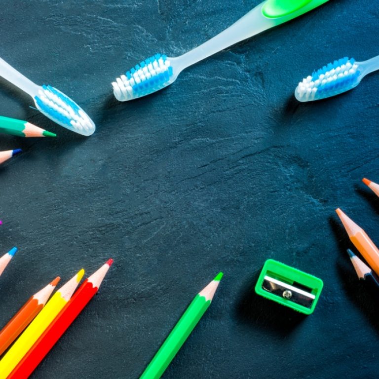 Colored,Pencils,Toothbrushes,And,A,Pencil,Sharpener