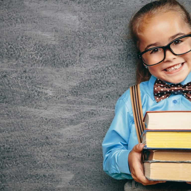 Beautiful,Smiling,Girl,Against,Chalkboard.,School,Concept