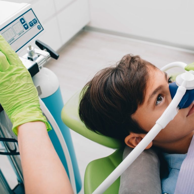 Little,Boy,Getting,Inhalation,Sedation,While,Teeth,Treatment,At,Dental