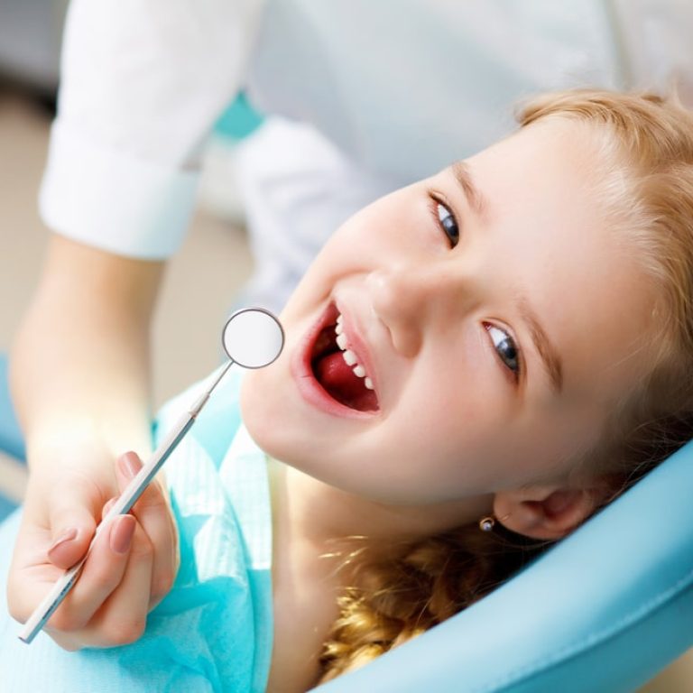 Little,Girl,Sitting,In,The,Dentists,Office