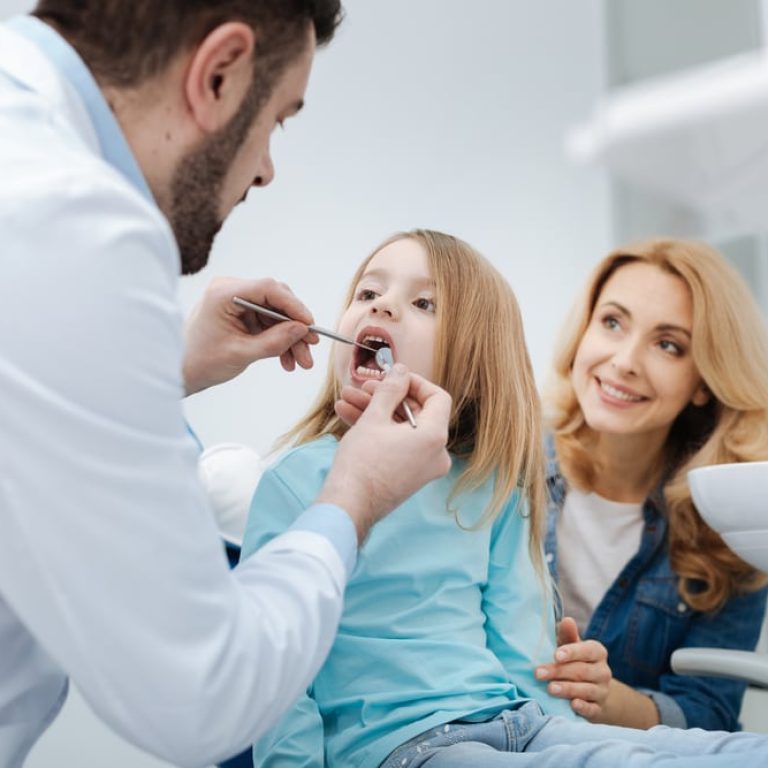 Attentive,Mom,Brining,Her,Child,To,The,Dentist