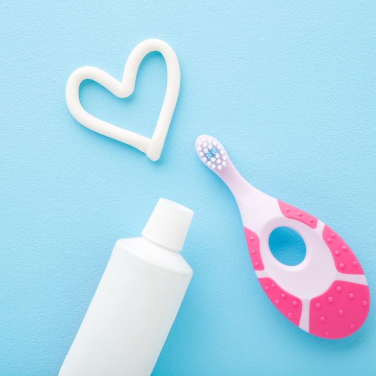 White,Heart,Shape,,Tube,Of,Toothpaste,,Pink,Toothbrush,On,Light