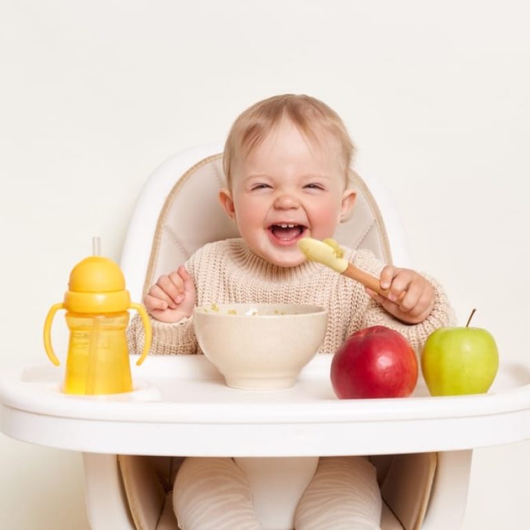 Baby,Wearing,Knitted,Sweater,Sitting,In,High,Chair,And,Feels