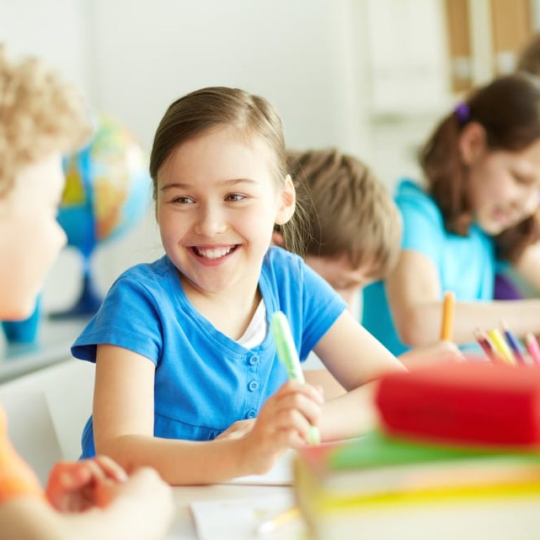 Portrait,Of,Happy,Pupil,Looking,At,Her,Classmate,At,Lesson