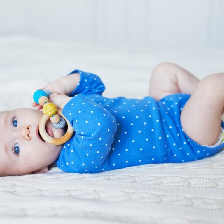 4,Months,Old,Baby,Girl,Playing,With,Colorful,Teething,Toy.
